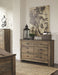 Trinell - Brown Dark - Six Drawer Dresser - 61.34" X 15.98" X 42.99" Sacramento Furniture Store Furniture store in Sacramento